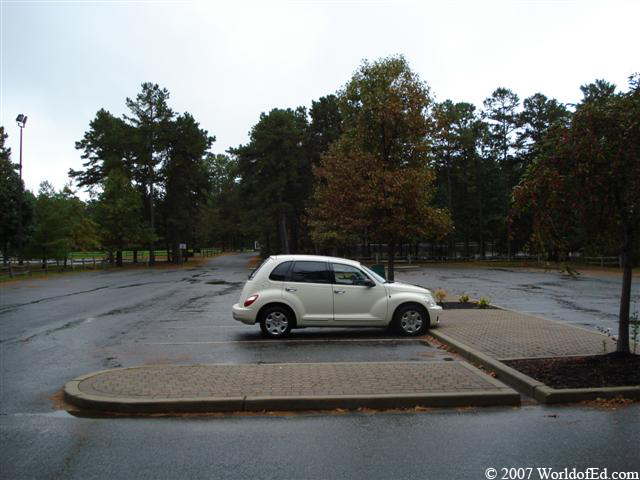 A PT Cruiser car parked in a parking lot.